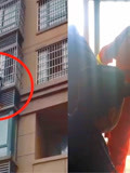 14岁女生因家庭矛盾从14楼窗户爬下，过路居民拍下惊险一幕